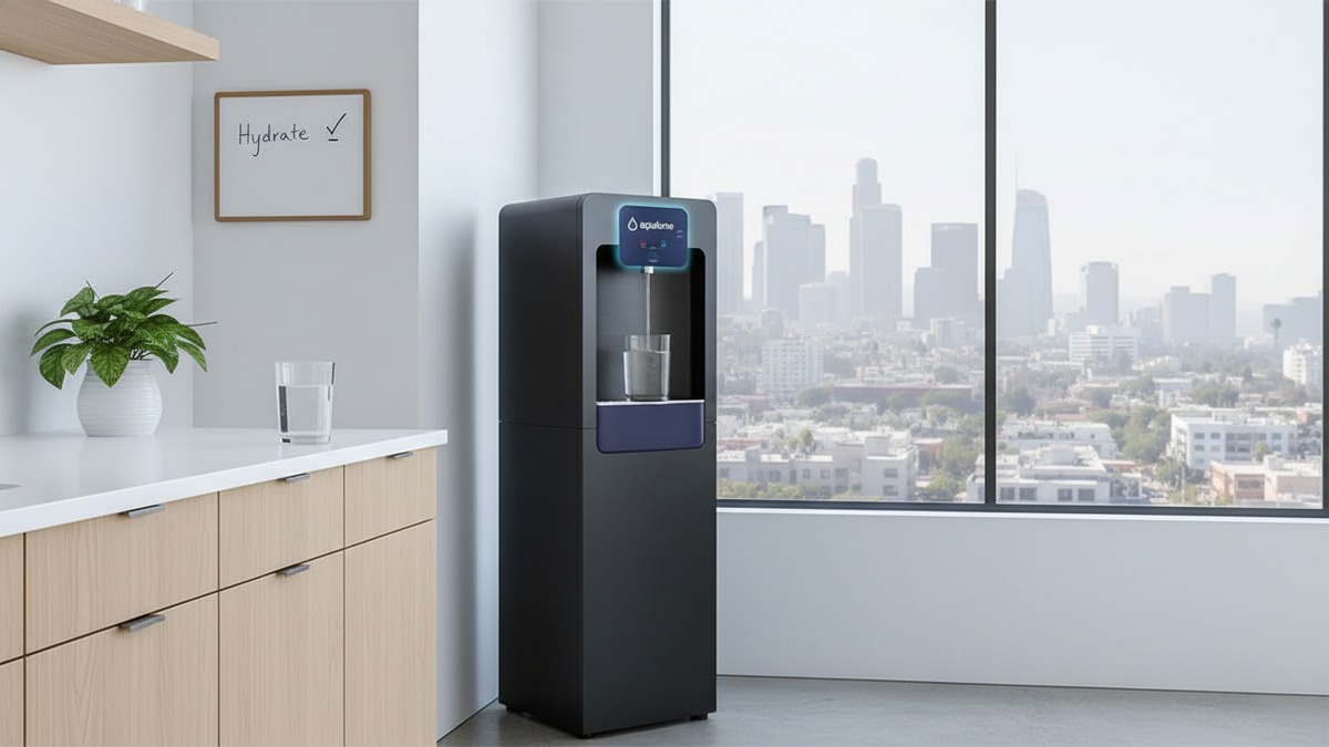 Aqualume Gulfstream water dispenser in an LA office showing clean filtered water against hazy LA skyline