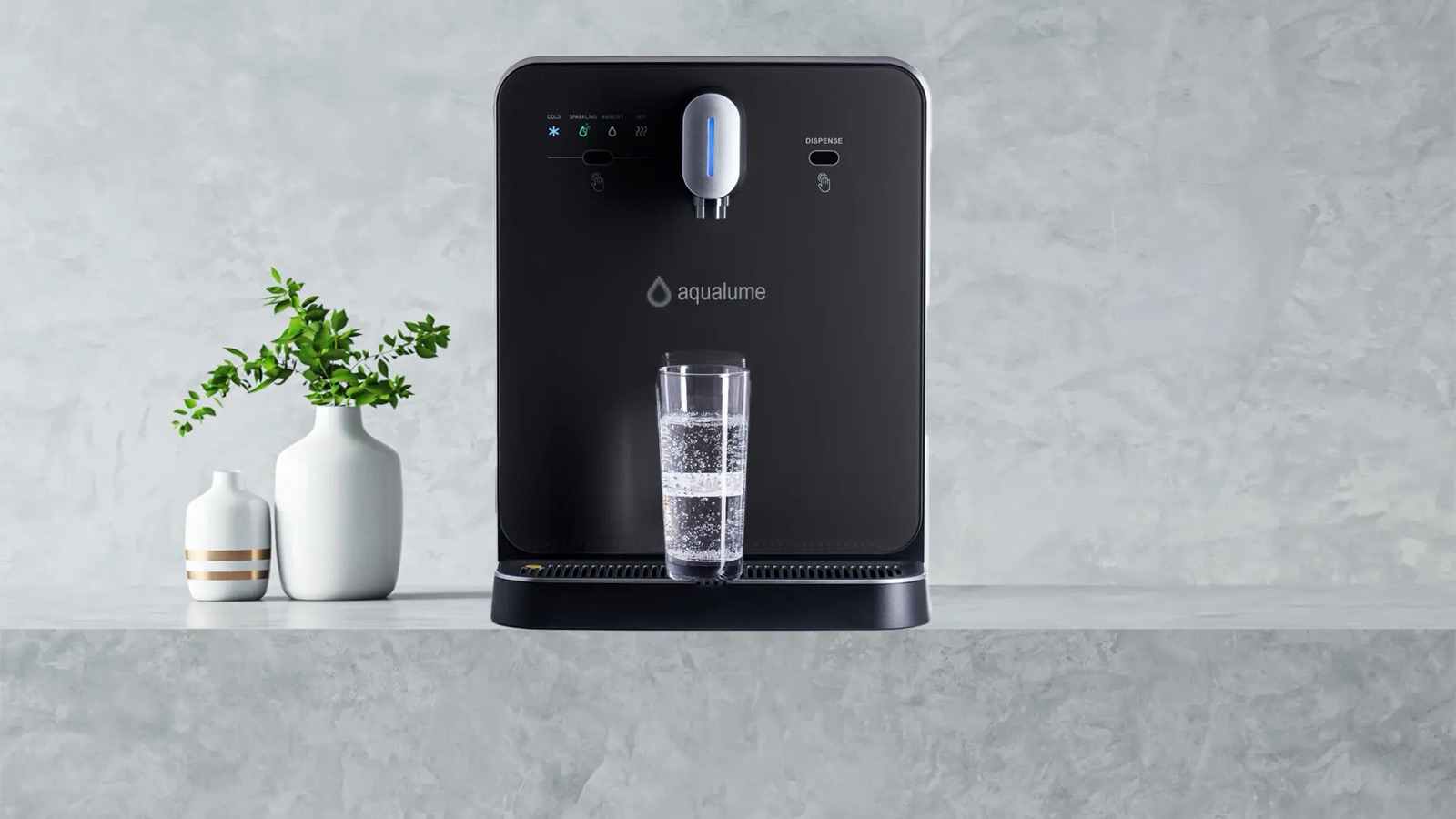 Aqualume tabletop water dispenser on a polished retail counter